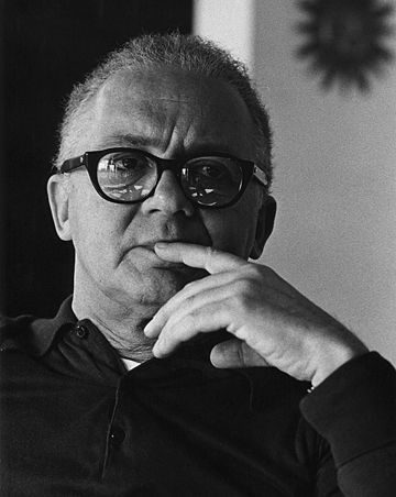 Black and white portrait of a thoughtful man with glasses