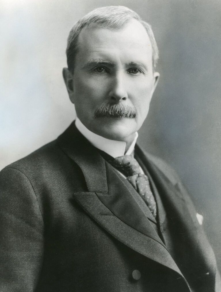 Black and white portrait of John D. Rockefeller in a suit